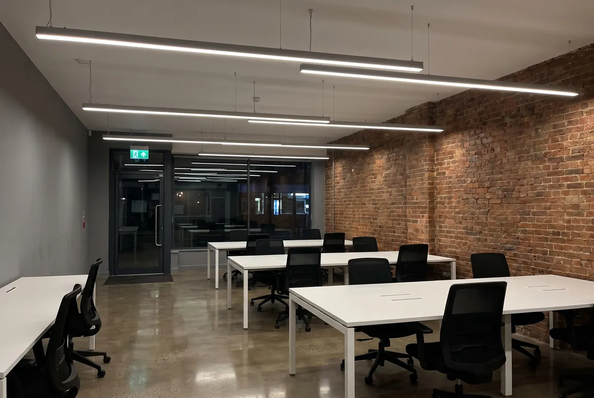 Office with long suspended linear LED lights