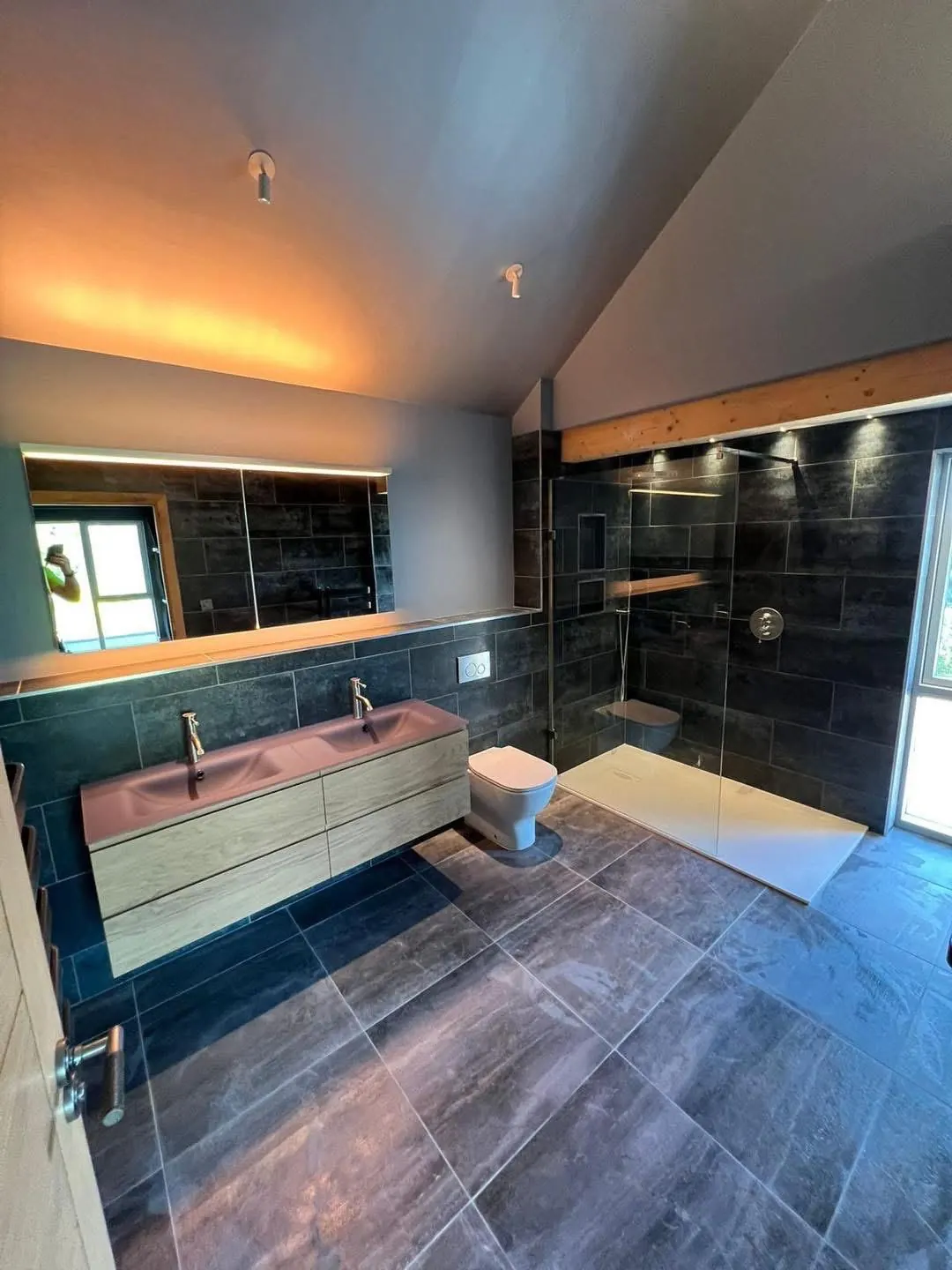 Slate bathroom with LED strip lighting