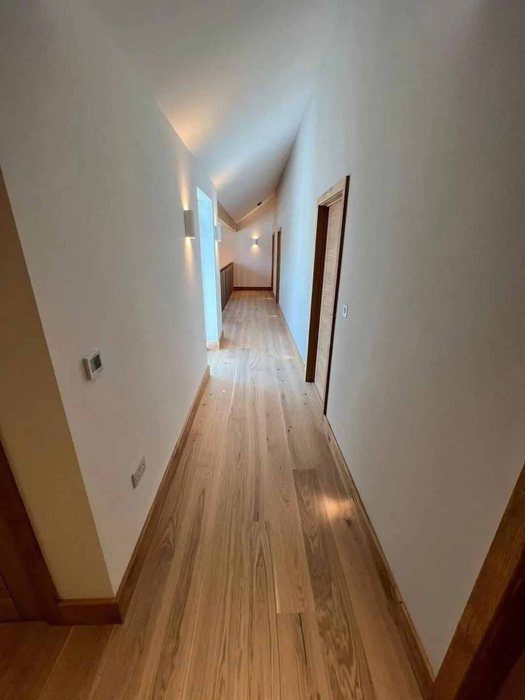 Long corridor with wall lights