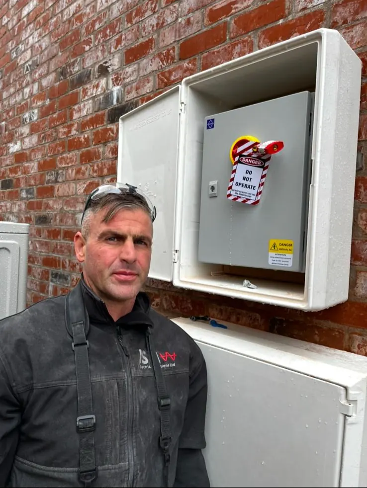 John from ISM Electrical on site, in branded workwear
